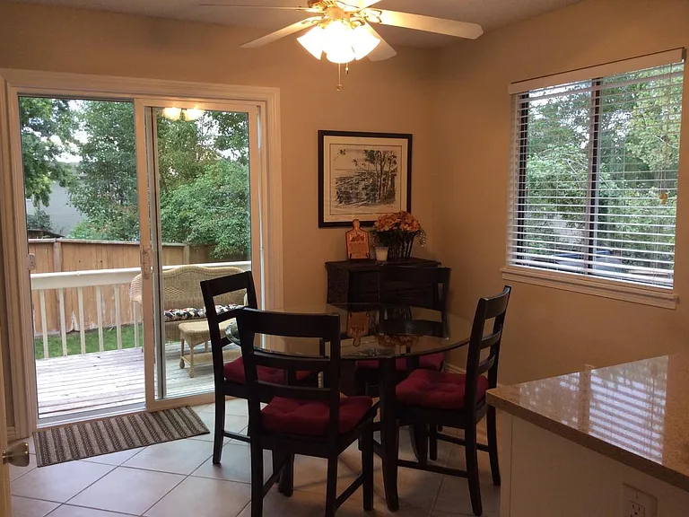 Spacious dining area with ceiling fan