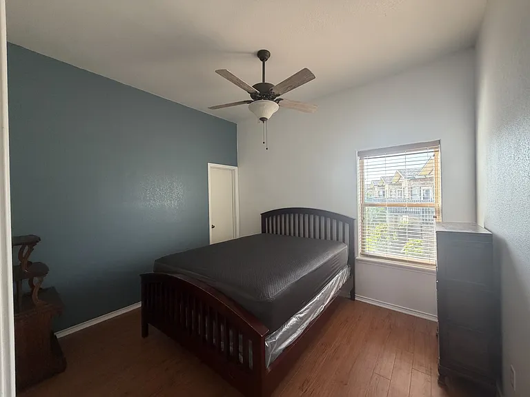 Guest bedroom with walk in closet.