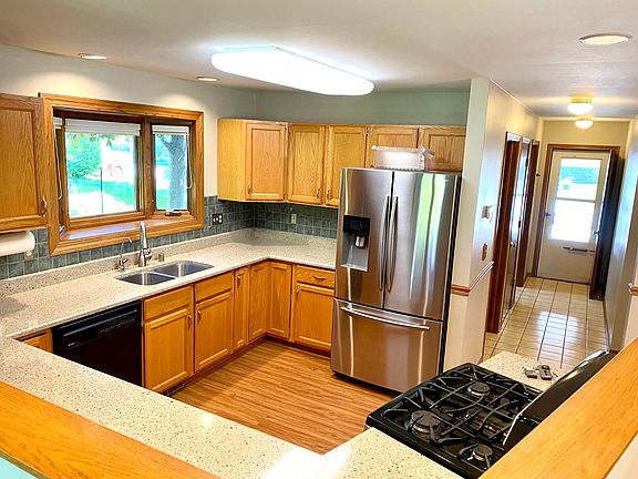 kitchen with premium appliances, gas stove, solid surface counter