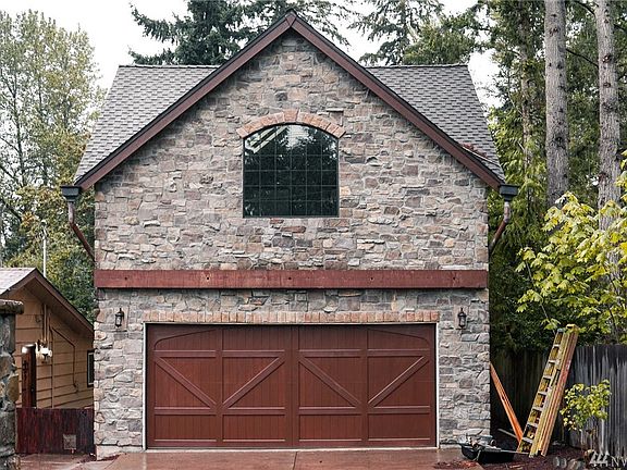 Detached 2 car garage with plenty of storage, finished upper level that has 3/4 bath and office/den.