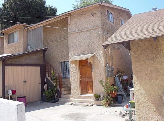 Middle Building with two units: one on first floor and second unit on the second floor.