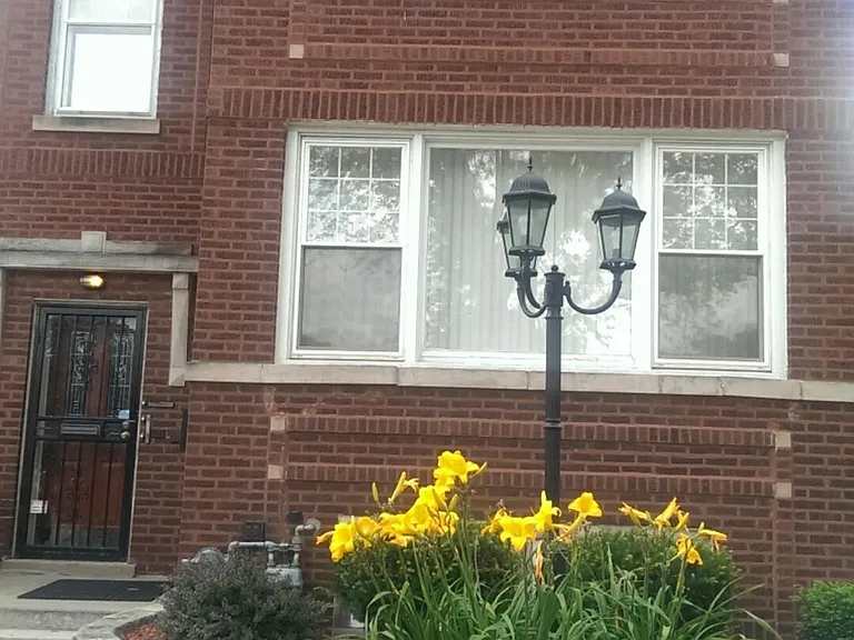 Manicured landscaping with security lighting.