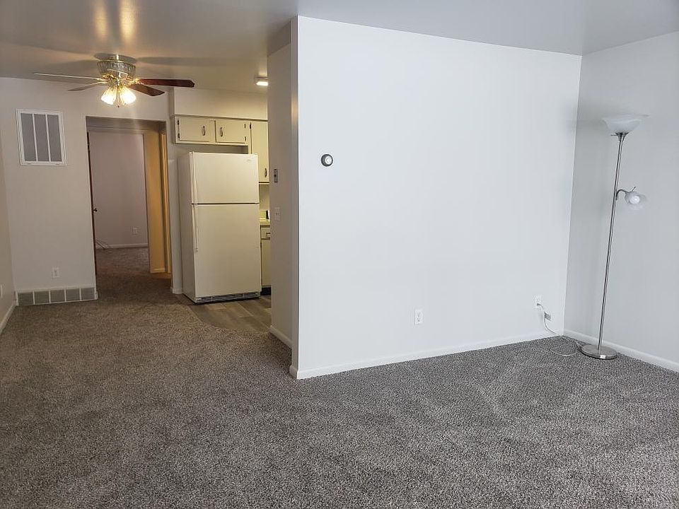 Living room from front door. Looking down the hall to kitchen and bedroom area.