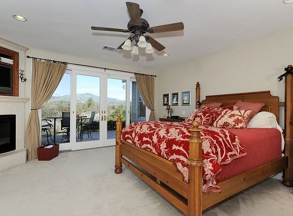 Luxurious master with fireplace and breathtaking views.