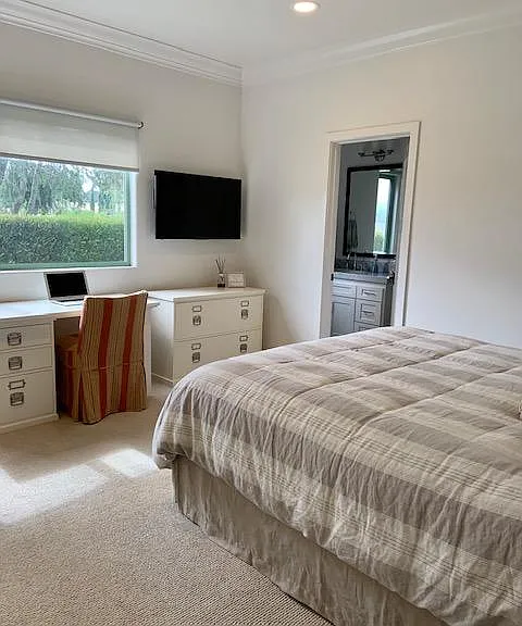 Downstairs guest room with king bed and tub/shower combo