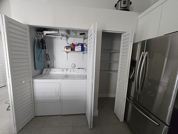 Laundry closet and pantry in kitchen