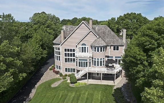 This home is filled with detail inside and out. Large windows allow natural light to flood the home and provides panoramic lakeside views.