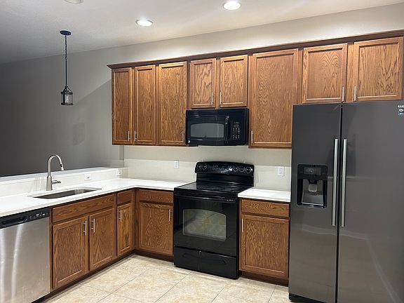 Updated kitchen with quartz countertops and backsplash