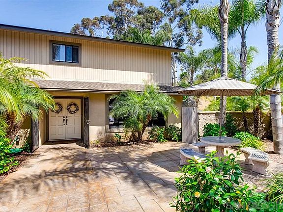 Lovely courtyard entry with stamped concrete and quality block wall