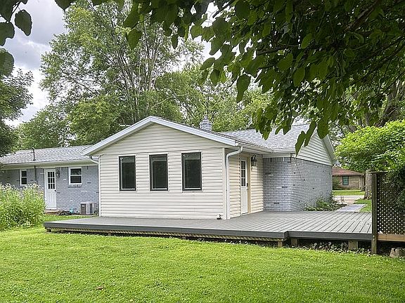 Back of house with deck