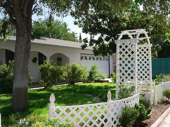 Beautiful mature landscape, stones leading to front 