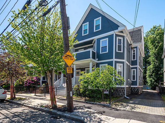 Front street view of a quiet residential neighborhood with traffic-calming speed humps.