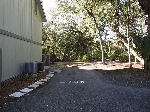 One assigned parking spot next to the entrance gate. One additional adjacent to this.