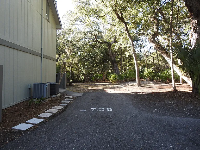 One assigned parking spot next to the entrance gate. One additional adjacent to this.