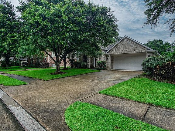 Driveway front entrance. 2- car attached garage.
