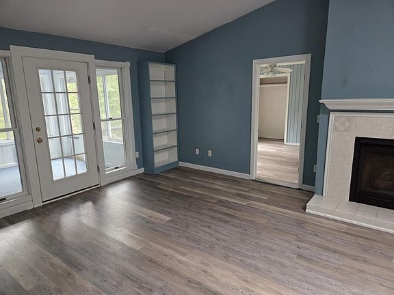 Living room into bedroom and sun porch