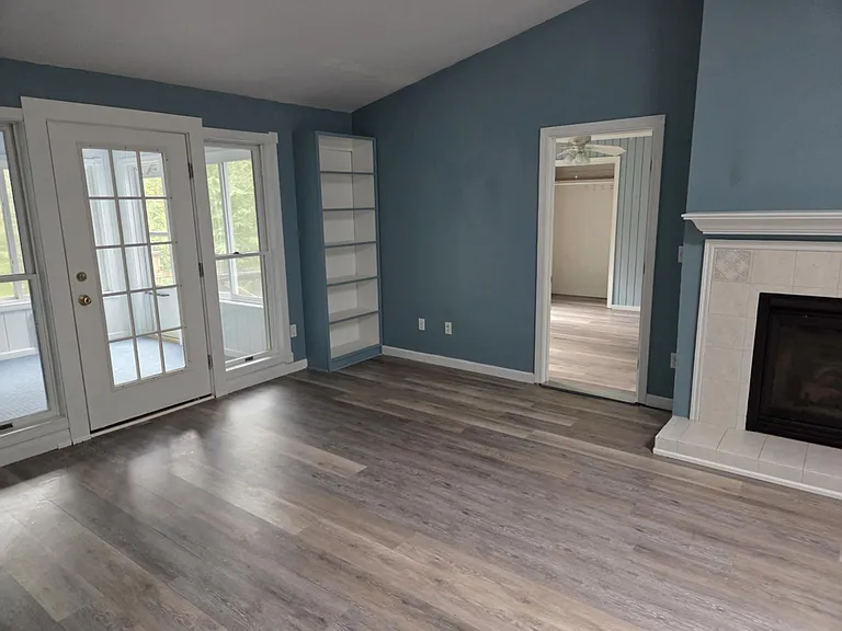 Living room into bedroom and sun porch