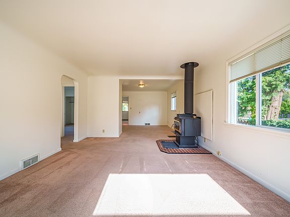 Living room opens to a dining room