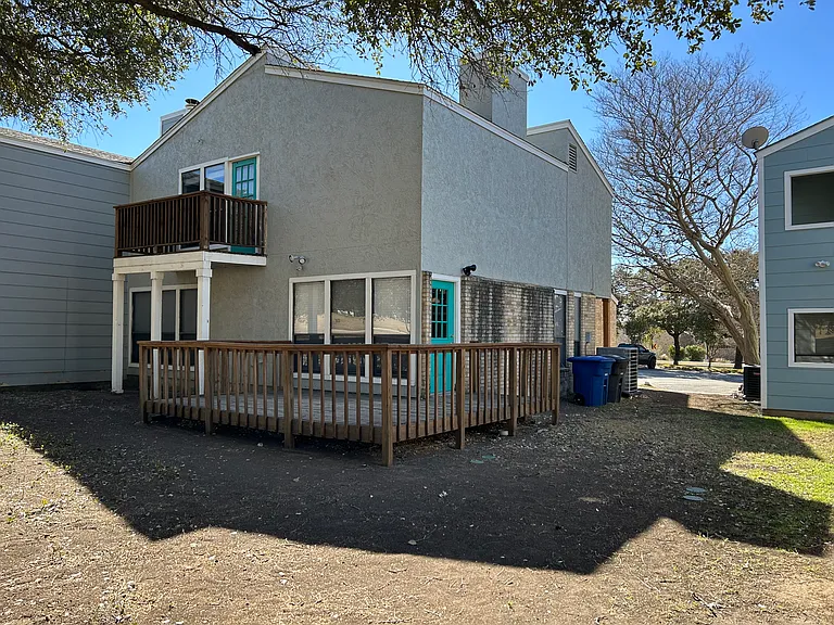 View of the back of the unit, the deck and the balcony.