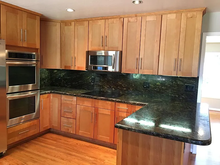 Large granite slab makes eat-in possible with barstool heigh