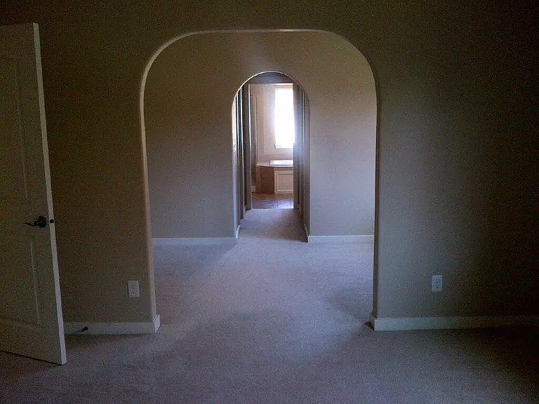 Over sized Master bedroom facing nook area/bathroom