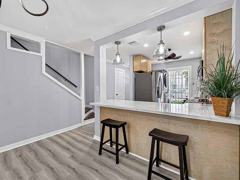 Another view of kitchen and the staircase to 2nd floor.