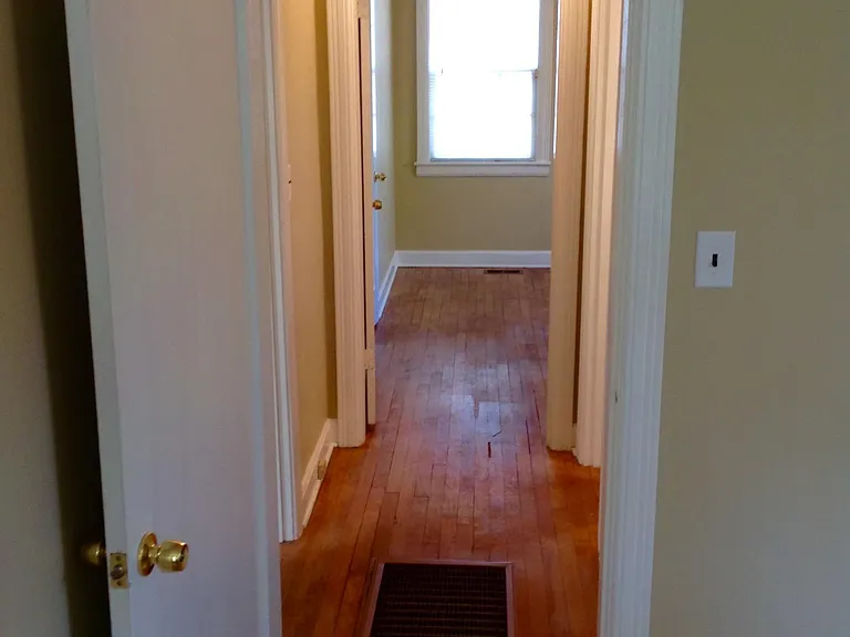 Hallway Between Two Bedrooms. Bathroom is to the Right.