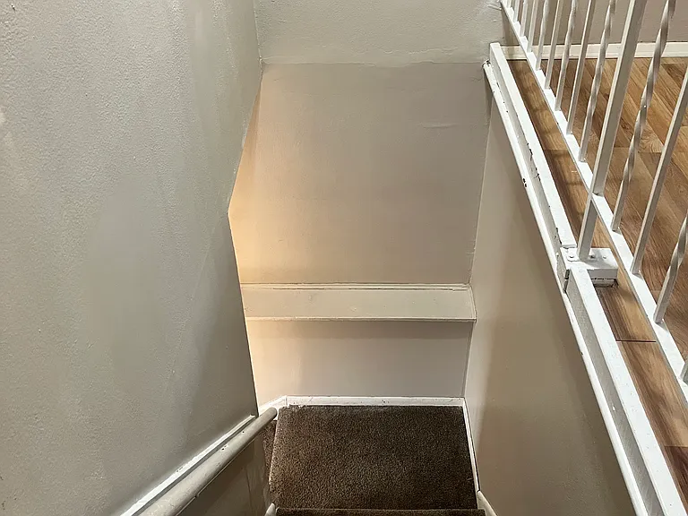 Stairs to lower level family room, bedroom and laundry room.