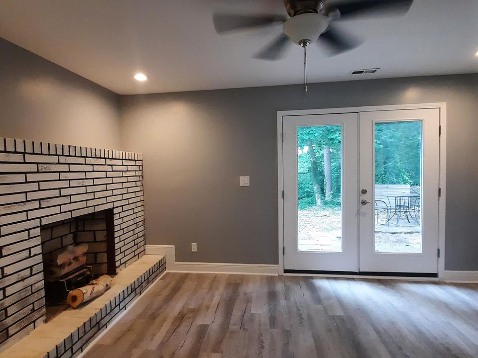 View from inside the apartment. There is a working fireplace the living room