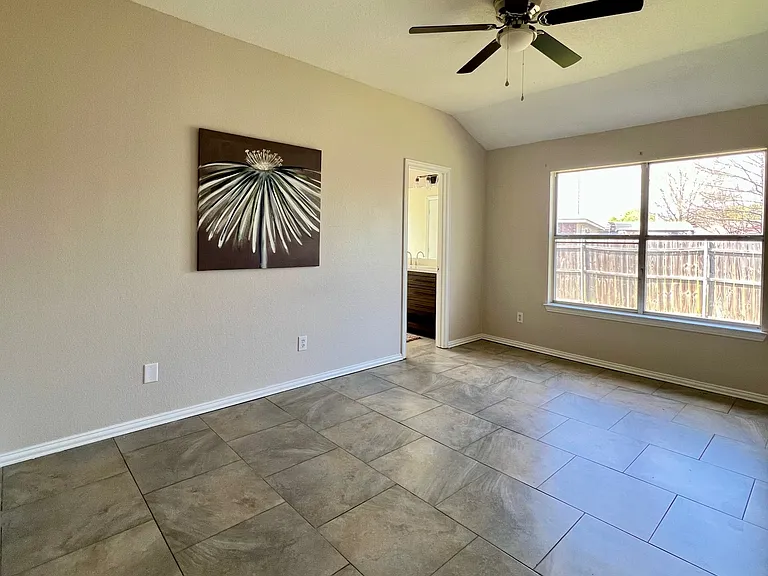 Spacious primary bedroom has private bath