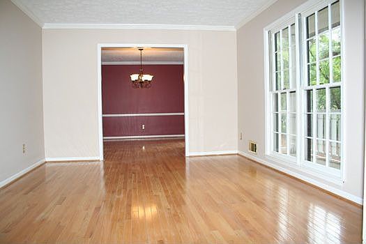 SEPARATE LIVING ROOM WITH HARDWOOD FLOORS AND OPEN TO THE DINING ROOM