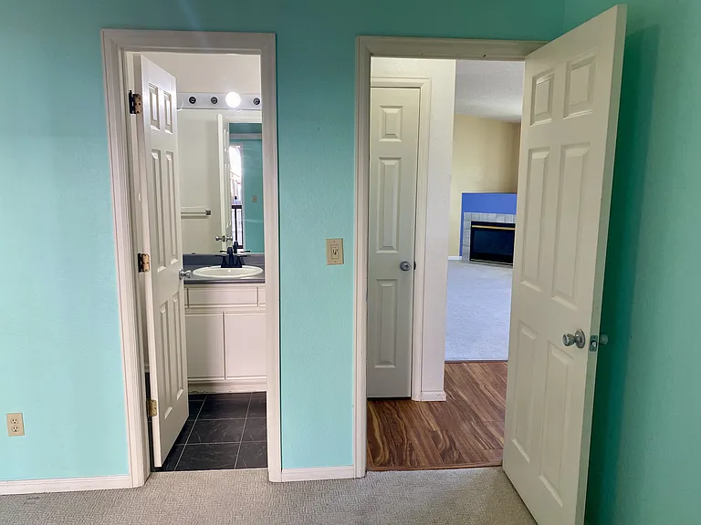 Easy access from the second bedroom to the adjoining full bath and main living space.
