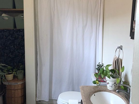 Large bathroom with deep closet and tub/shower