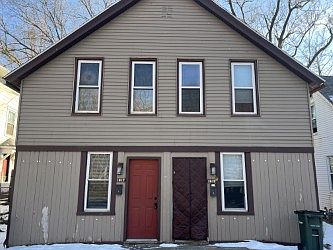 Front of house, entry door to left.