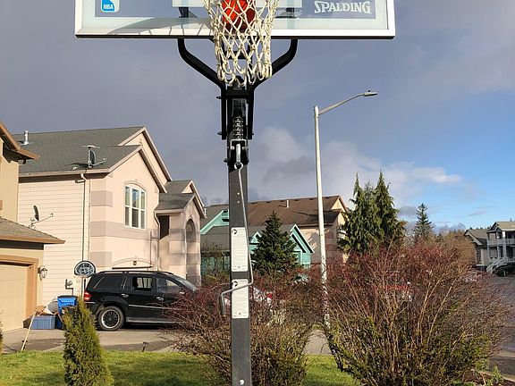 Built in adjustable height basketball goal with flat driveway! No more playing in the street dodging cars or basketball goals that blow over in the wind!