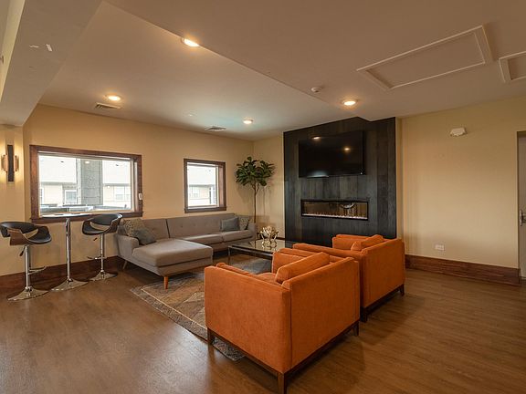 Fireplace Lounging area in 3-Story Resident Clubhouse