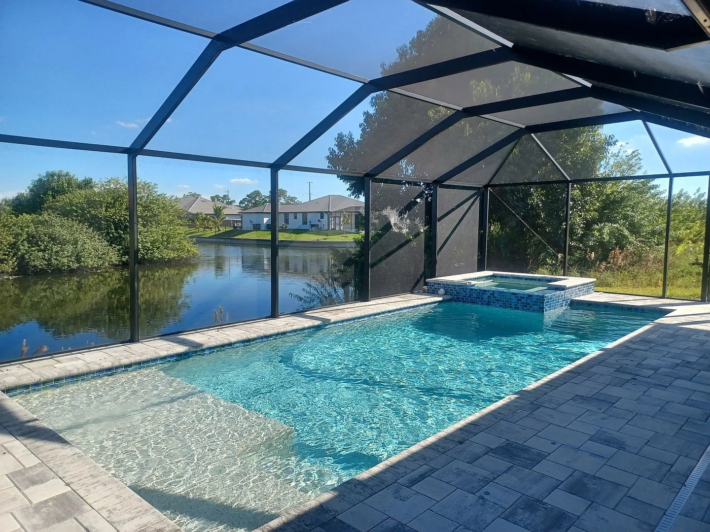 Coming Soon 3 BR / 2 BA Home with Pool Overlooking a Canal — Photo 1