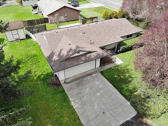 There is plenty of parking with the large driveway and that beautiful roof is brand new