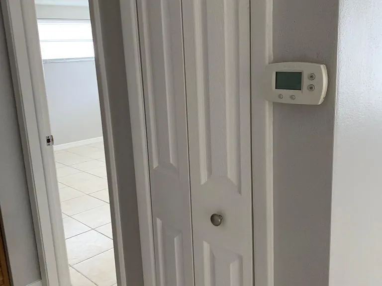 Hallway with Closet Leading to First Bedroom