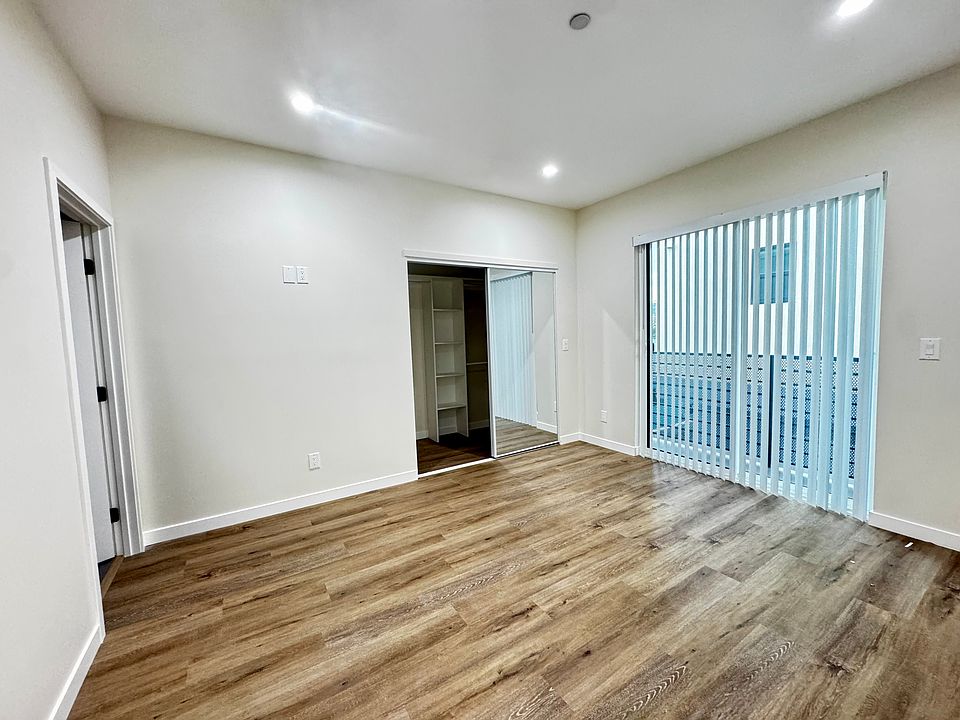 Primary bedroom with private balcony and ensuite bath