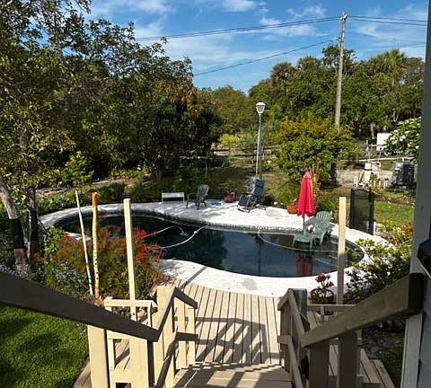 Private studio entrance facing backyard pool.