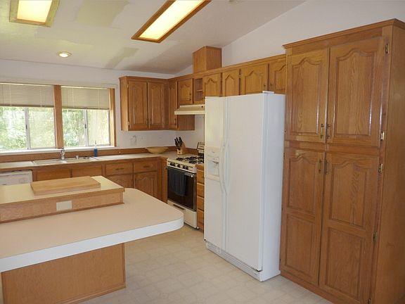 Kitchen with tons of cabinets and center island.