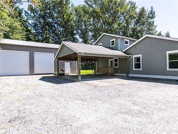 Huge 1200 sqft shop/garage with high-bay doors, perfect for RV and boat parking