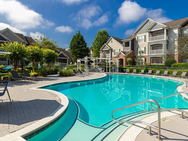 Lounge on our expansive sundeck, offering plentiful seating for your perfect poolside experience.