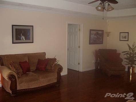 Living room with trey ceilings...