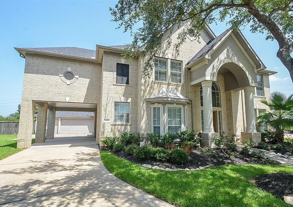 Three car, oversized garage! You have room for your cars and more! The porte cochere is a great place to park to unload groceries through the side door leading to the kitchen.