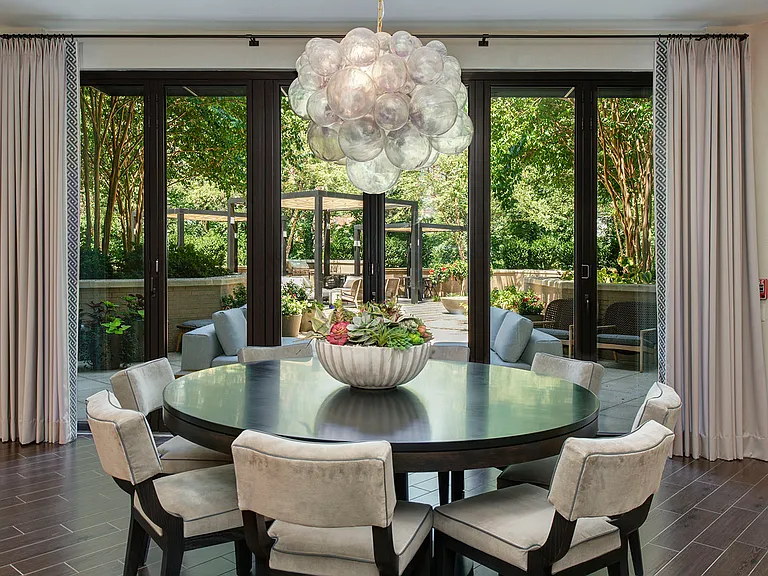 The resident lounge provides comfortable seating, a TV and opens up to the resident terrace