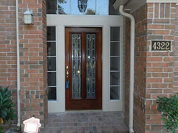 The entry door features a beautiful cut glass door.