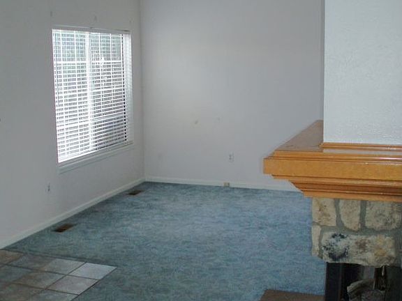 Fireplace warms cozy living and dining rooms