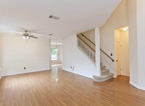 From front door looking towards kitchen/breakfast/family area.  Powder bath and closet to the right.